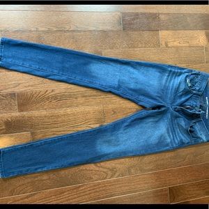 Dark colored tight jeans